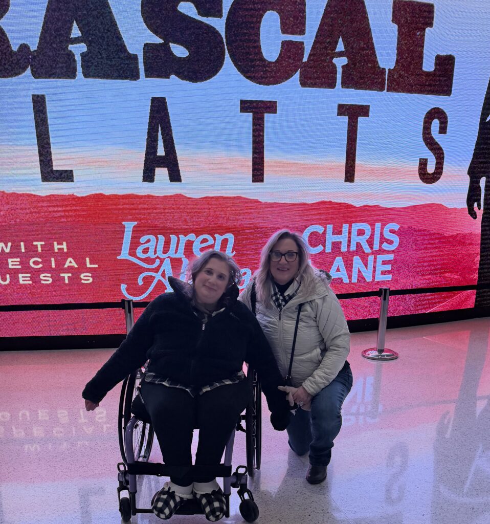 Sam and Mom in the atrium at Fiserv Forum